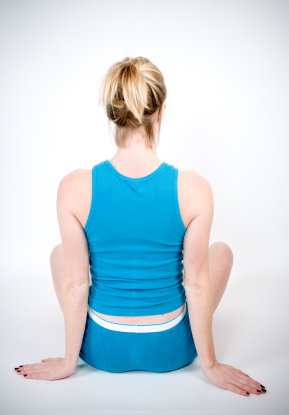 Girl sitting in upright posture